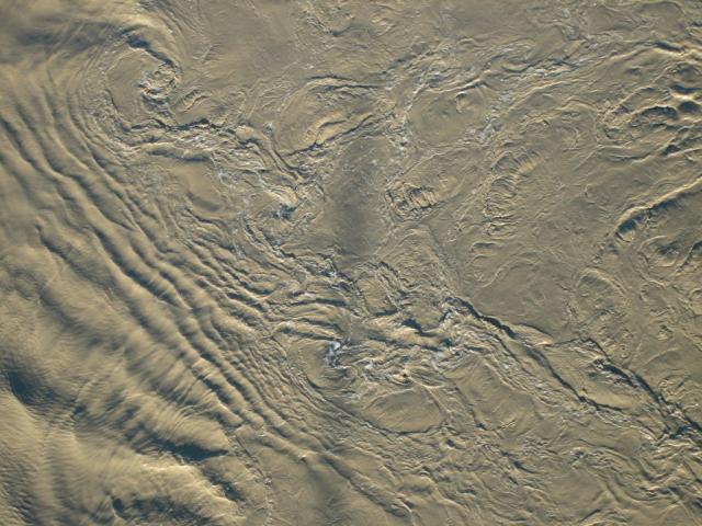 Fast flowing river causing vortexes and ripples